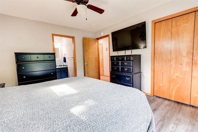 858 Willow Ct SW, Ocean Shores, WA 98569 - bedroom featuring light wood finished floors, a closet, ensuite bath, and ceiling fan