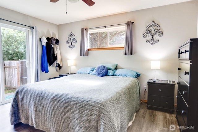 858 Willow Ct SW, Ocean Shores, WA 98569 - bedroom featuring multiple windows, wood finished floors, ceiling fan, and access to outside