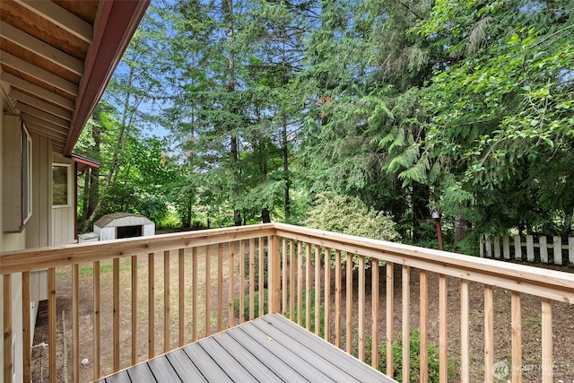 1563 Nylace Ln SE, Port Orchard, WA 98367 - deck featuring a storage unit and view of wooded area