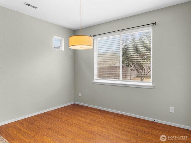 2220 166th St Ct E, Tacoma, WA 98445 - unfurnished dining area with baseboards and wood finished floors