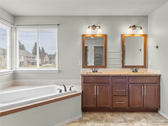 2220 166th St Ct E, Tacoma, WA 98445 - full bathroom featuring double vanity, plenty of natural light, and a bath