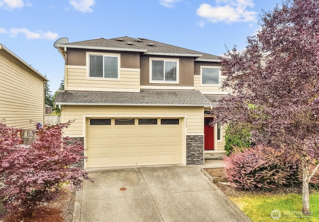 2220 166th St Ct E, Tacoma, WA 98445 - view of front facade with a shingled roof, stone siding, concrete driveway, and an attached garage