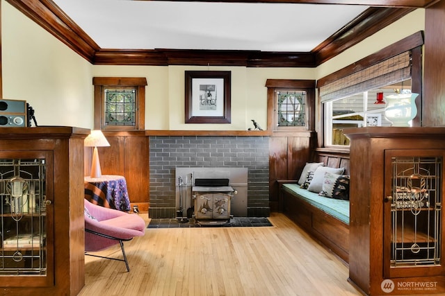 4926 42nd Ave S, Seattle, WA 98118 - sitting room featuring a brick fireplace, crown molding, plenty of natural light, and wood finished floors