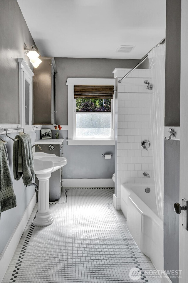 4926 42nd Ave S, Seattle, WA 98118 - full bathroom featuring shower / bathtub combination with curtain and tile patterned floors