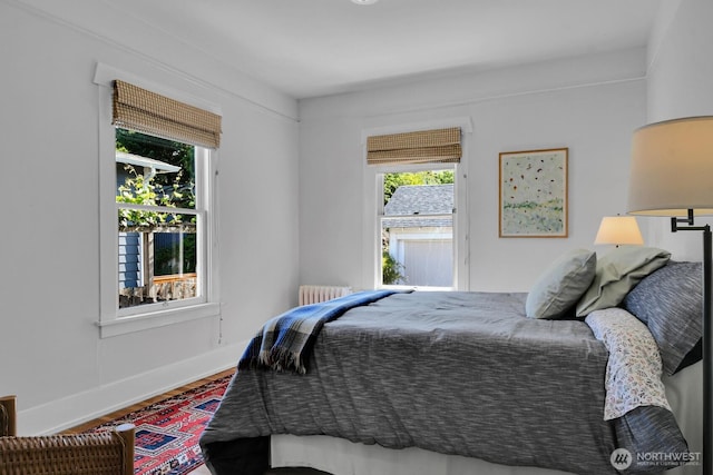 4926 42nd Ave S, Seattle, WA 98118 - bedroom featuring radiator and wood finished floors