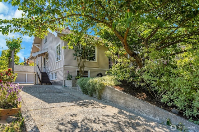 4926 42nd Ave S, Seattle, WA 98118 - view of front facade with driveway and stairway