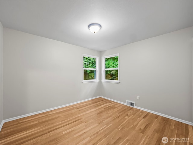 4510 N 24th St, Tacoma, WA 98406 - unfurnished room featuring baseboards and light wood-style flooring