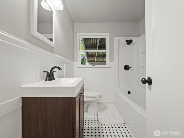 4510 N 24th St, Tacoma, WA 98406 - full bath featuring wainscoting, a decorative wall, vanity, tile patterned floors, and washtub / shower combination