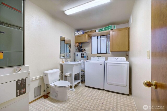 17417 28th Ave SE, Bothell, WA 98012 - washroom with washer and clothes dryer, light flooring, and water heater