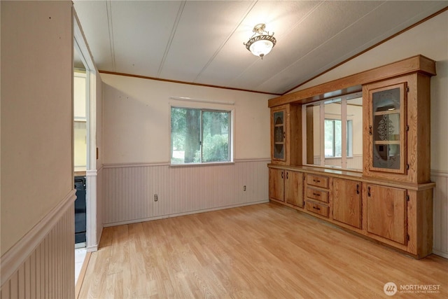 31109 202nd Ave SE, Kent, WA 98042 - unfurnished dining area with a wainscoted wall, light wood-type flooring, and vaulted ceiling