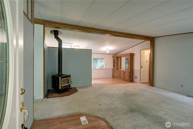 31109 202nd Ave SE, Kent, WA 98042 - unfurnished living room featuring a wood stove and carpet flooring