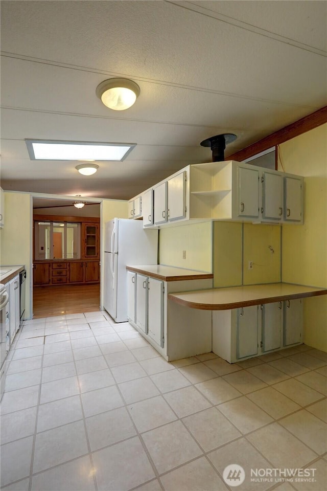 31109 202nd Ave SE, Kent, WA 98042 - kitchen with freestanding refrigerator, light countertops, and light tile patterned floors