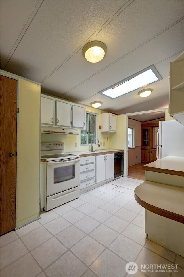 31109 202nd Ave SE, Kent, WA 98042 - kitchen featuring white appliances, under cabinet range hood, white cabinetry, light countertops, and light tile patterned floors