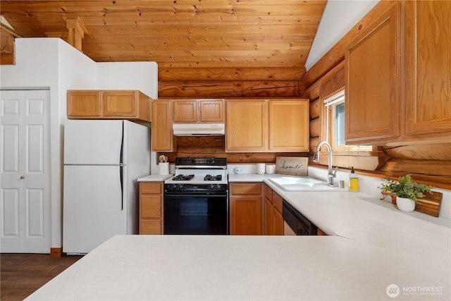 8669 Harbor Dr, Blaine, WA 98230 - kitchen with range with gas cooktop, freestanding refrigerator, under cabinet range hood, log walls, and dishwasher