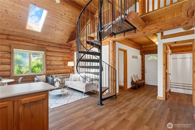 8669 Harbor Dr, Blaine, WA 98230 - living area with stairs, wood ceiling, a skylight, wood finished floors, and high vaulted ceiling