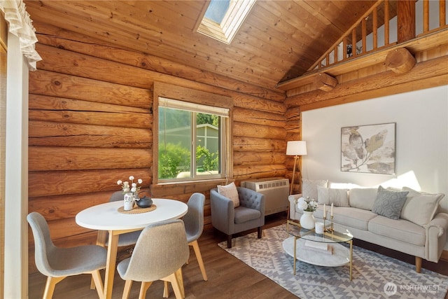 8669 Harbor Dr, Blaine, WA 98230 - living area with a skylight, wood finished floors, lofted ceiling, a wall unit AC, and wooden ceiling