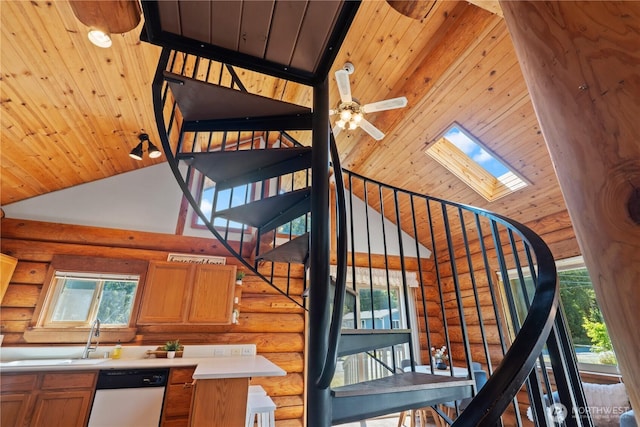 8669 Harbor Dr, Blaine, WA 98230 - staircase featuring log walls, high vaulted ceiling, a skylight, wooden ceiling, and ceiling fan