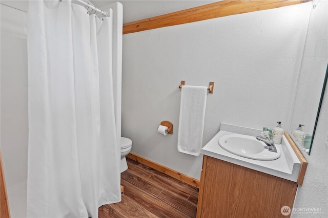 8669 Harbor Dr, Blaine, WA 98230 - full bath with vanity, wood finished floors, and a shower with shower curtain