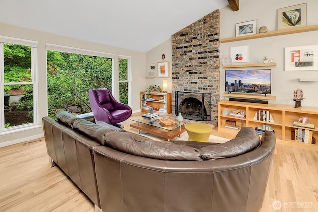 6713 128th Ave SE, Bellevue, WA 98006 - living area with light wood-type flooring, a brick fireplace, beam ceiling, and high vaulted ceiling