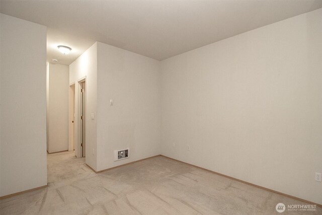 12712 Admiralty Way Unit F106, Everett, WA 98204 - unfurnished room featuring light colored carpet and baseboards