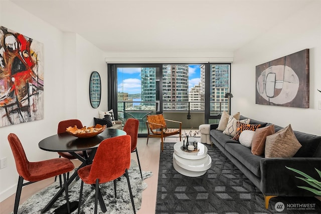 300 Virginia St Unit 1311, Seattle, WA 98101 - living area with wood finished floors and a city view