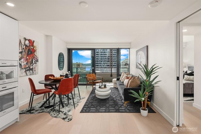300 Virginia St Unit 1311, Seattle, WA 98101 - dining space featuring wood finished floors and recessed lighting
