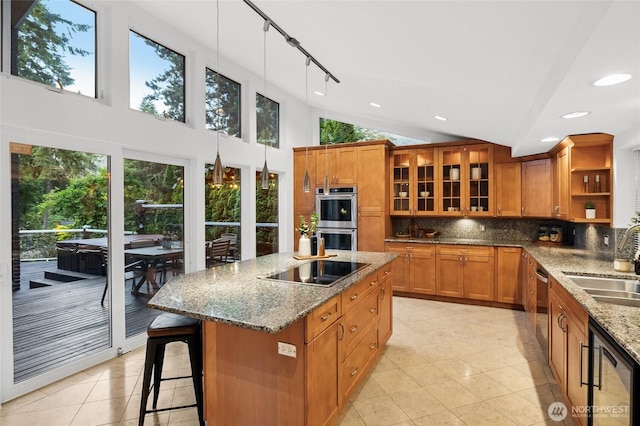 1564 Hillside Dr SE, Issaquah, WA 98027 - kitchen featuring black electric stovetop, brown cabinetry, stainless steel double oven, open shelves, and recessed lighting