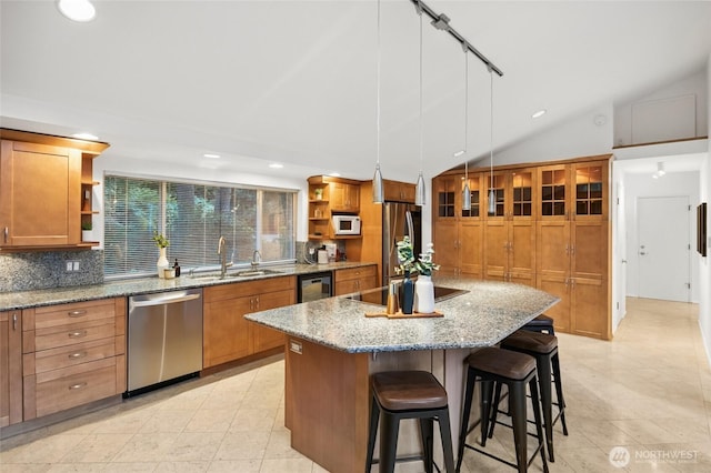 1564 Hillside Dr SE, Issaquah, WA 98027 - kitchen featuring stainless steel appliances, open shelves, lofted ceiling, a center island, and tasteful backsplash