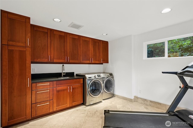 1564 Hillside Dr SE, Issaquah, WA 98027 - laundry area featuring cabinet space, light tile patterned flooring, recessed lighting, and washing machine and dryer