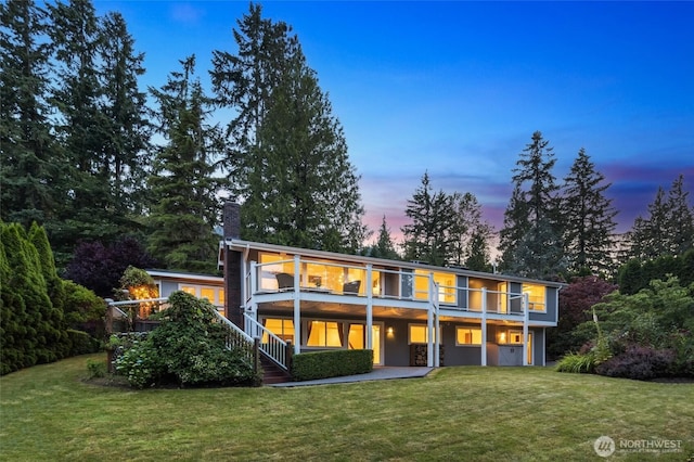 1564 Hillside Dr SE, Issaquah, WA 98027 - rear view of house with a lawn, a chimney, and stairway