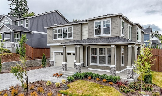 16321 SE 133rd Pl, Renton, WA 98059 - craftsman house featuring an attached garage, concrete driveway, a shingled roof, and covered porch