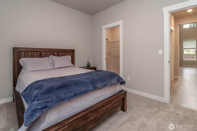 16321 SE 133rd Pl, Renton, WA 98059 - carpeted bedroom with baseboards and a spacious closet