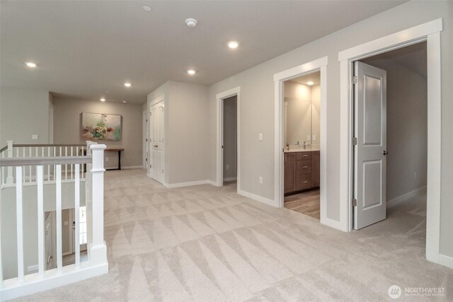 16321 SE 133rd Pl, Renton, WA 98059 - hallway featuring light colored carpet, recessed lighting, and an upstairs landing
