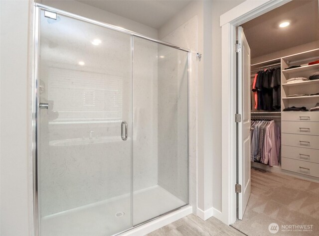 16321 SE 133rd Pl, Renton, WA 98059 - bathroom with a stall shower, a walk in closet, and recessed lighting