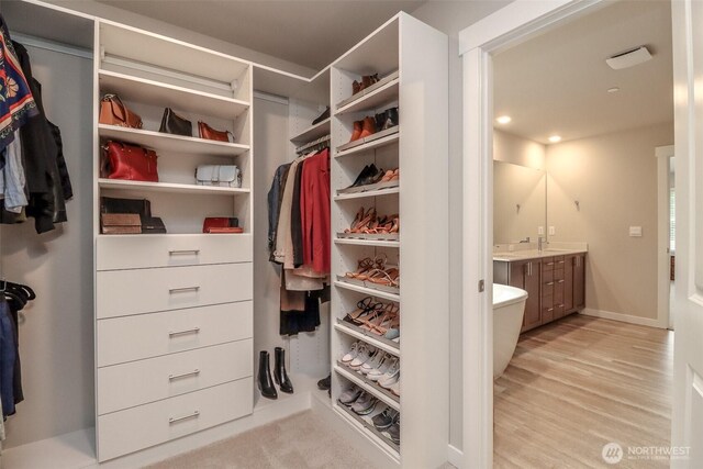 16321 SE 133rd Pl, Renton, WA 98059 - walk in closet with light wood-style floors