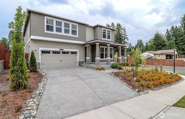 16321 SE 133rd Pl, Renton, WA 98059 - view of front facade featuring a porch, stone siding, an attached garage, and concrete driveway