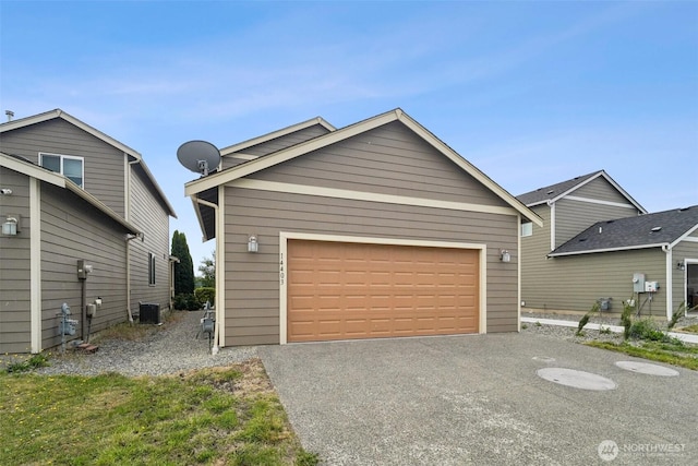 14403 Lockwood Ln SE, Yelm, WA 98597 - view of front facade with a garage and asphalt driveway