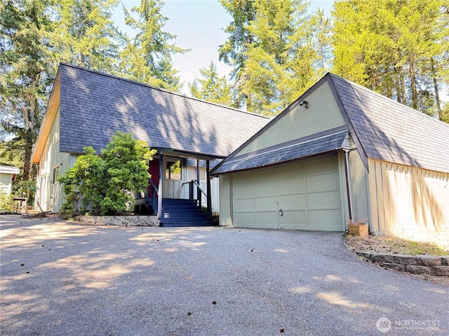 110 E Rhododendron Ln, Union, WA 98592 - view of front of home with asphalt driveway and roof with shingles