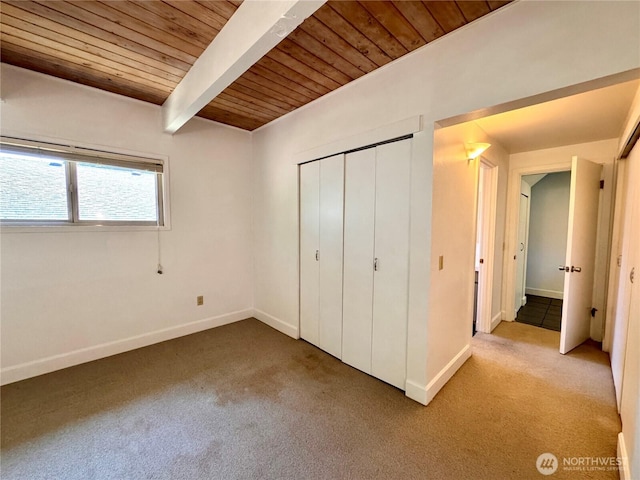 110 E Rhododendron Ln, Union, WA 98592 - unfurnished bedroom featuring a wooden ceiling with exposed beams, carpet flooring, and a closet
