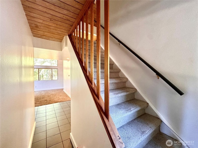 110 E Rhododendron Ln, Union, WA 98592 - stairs with carpet flooring, wood ceiling, and tile patterned flooring