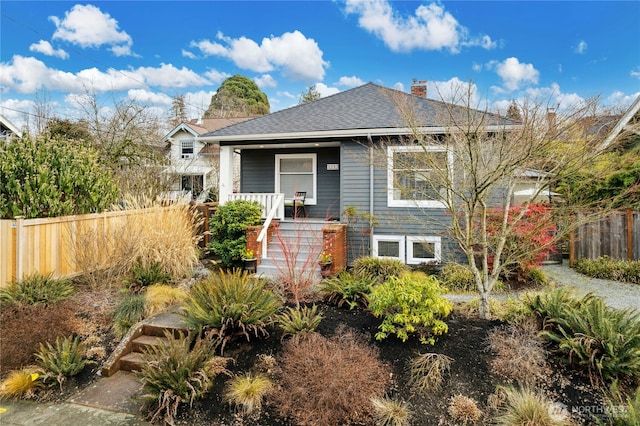 3232 37th Ave S, Seattle, WA 98144 - bungalow featuring covered porch, a chimney, stairs, and roof with shingles