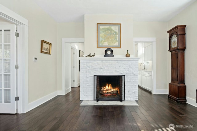 3232 37th Ave S, Seattle, WA 98144 - living area with dark wood finished floors and a fireplace