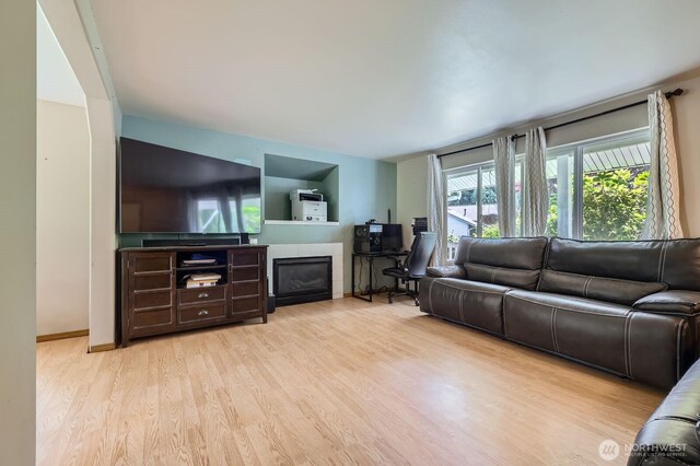 9806 6th Pl SE, Lake Stevens, WA 98258 - living area featuring a tile fireplace and wood finished floors
