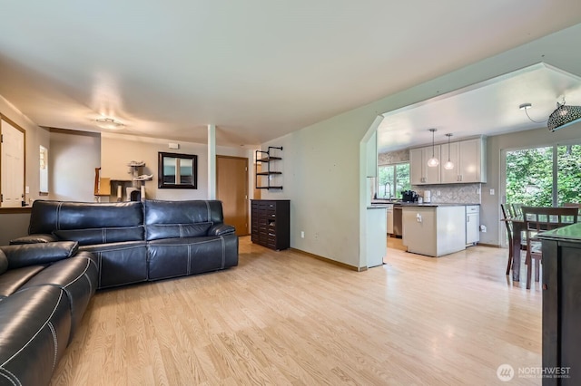 9806 6th Pl SE, Lake Stevens, WA 98258 - living area with light wood finished floors and arched walkways