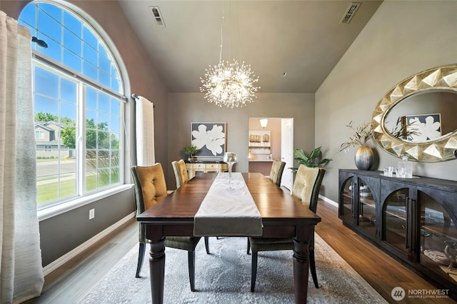 52 Whistling Duck Rd, Walla Walla, WA 99362 - dining space with a chandelier, wood finished floors, and high vaulted ceiling