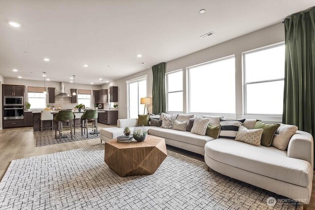 16204 SE 133rd Pl Unit 101, Renton, WA 98059 - living area featuring recessed lighting and light wood finished floors
