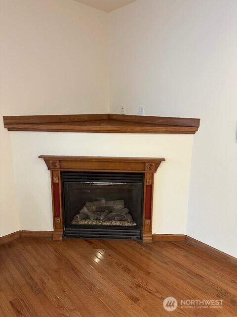 6829 Weedin Pl NE, Seattle, WA 98115 - detailed view of a glass covered fireplace and wood finished floors