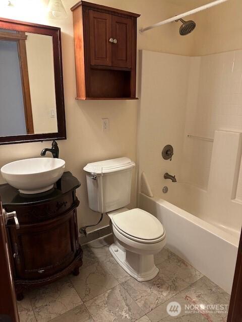 6829 Weedin Pl NE, Seattle, WA 98115 - bathroom featuring  shower combination, vanity, and marble finish flooring