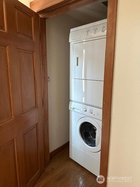 6829 Weedin Pl NE, Seattle, WA 98115 - washroom featuring stacked washer / drying machine and wood finished floors