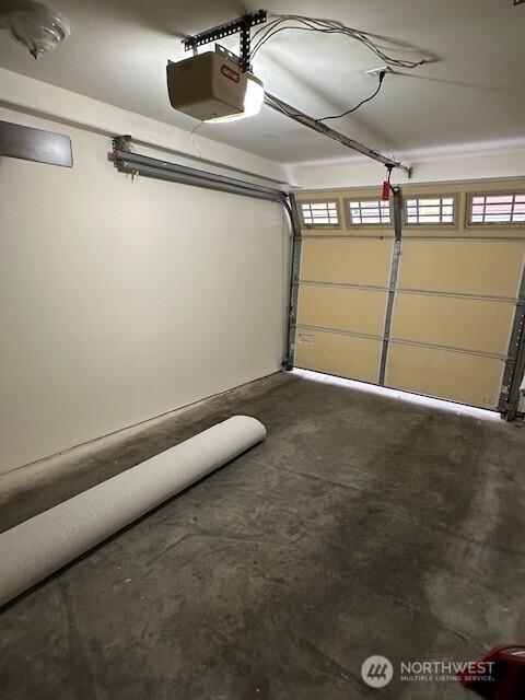 6829 Weedin Pl NE, Seattle, WA 98115 - garage featuring a garage door opener